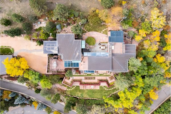 Aerial drone photo looking straight down at a house during the day.